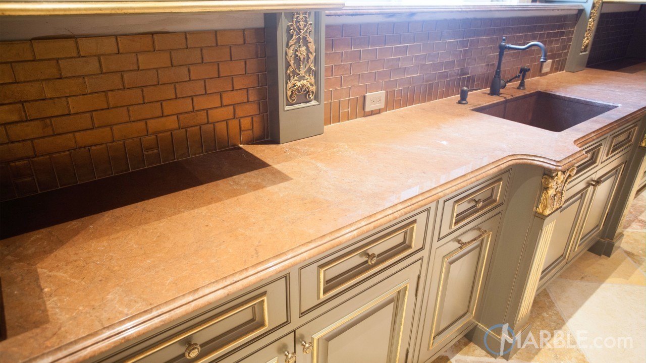 Guide To Purchasing A Countertop - Breccia Montana Quartzite with a Custom Stone Sink - Image Via marble.com