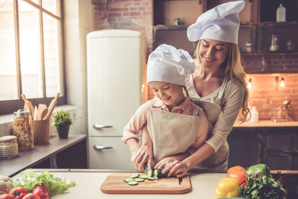 Mother and daughter cooking