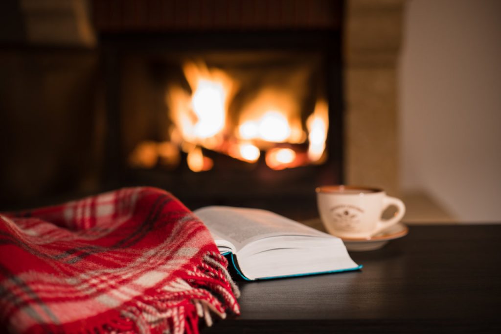 Open fire, blanket, book.