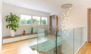 Modern glass banisters and modern lighting