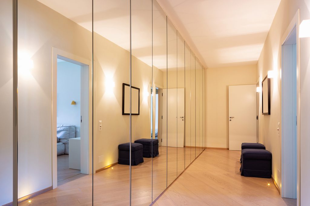 Mirrors and lighting to brighten hallway