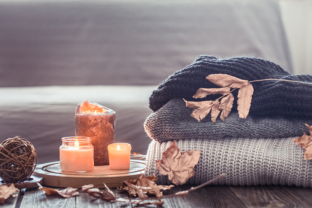 Cozy autumn with candles and a sweater