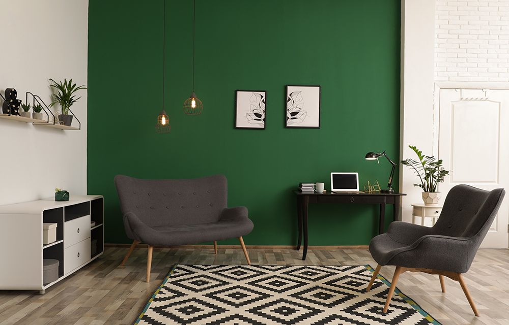 Green living room with grey chairs and vinyl flooring