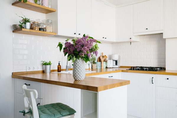 White kitchen cabinets with wooden worktops