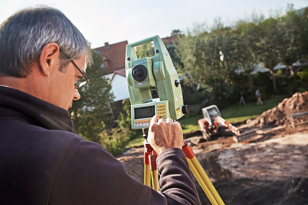 Lland surveyor, geodesist at work