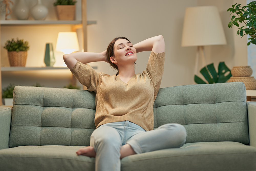 Women relaxing on sofa