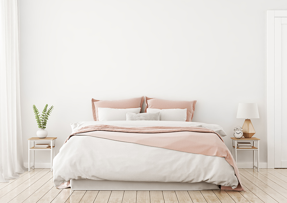 Peaceful, relaxing bedroom with white and pastal pink.