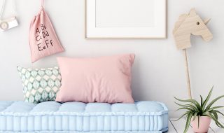 Thick blue childs mattress with pink pillow