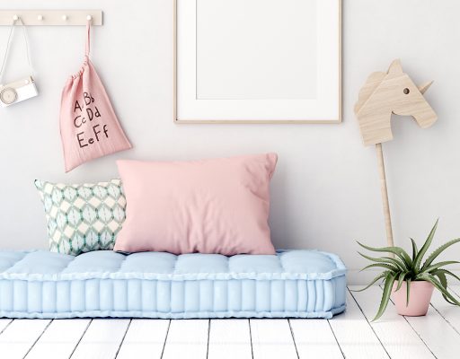 Thick blue childs mattress with pink pillow