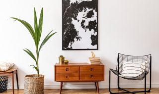 Woodwn 70s style sideboard and black and white wall art