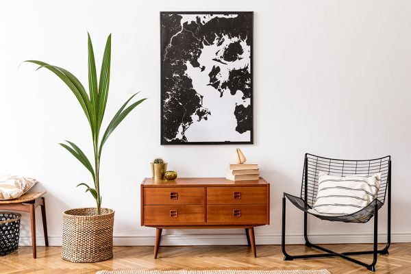 Woodwn 70s style sideboard and black and white wall art