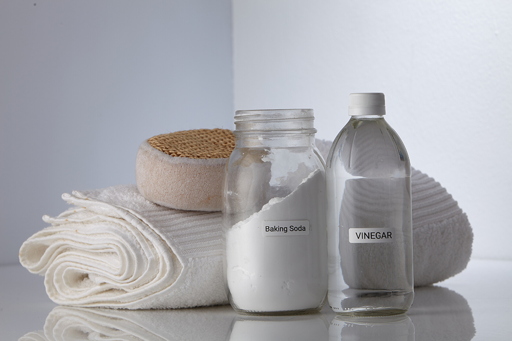 Natural cleaning products. White vinegar and Baking soda