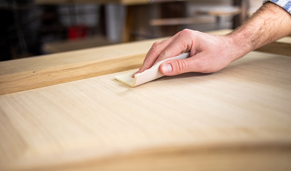 Sanding a wooden board