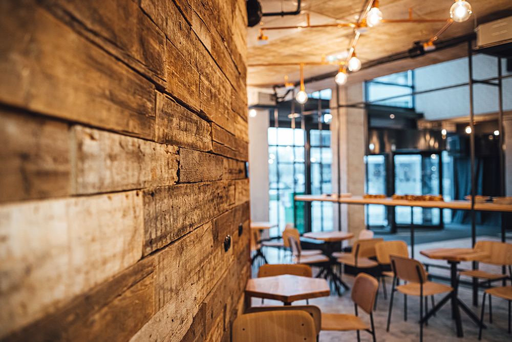 Recycled wooden pallet used as wall cover in cafe/restaurant
