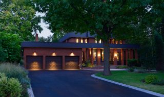 Tarmac driveway to large well lite house